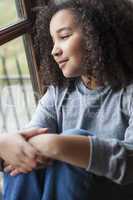 Mixed Race African American Girl Looking Out of Window