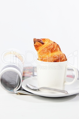 Coffee and magazine on a white