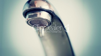 dropping faucet close-up