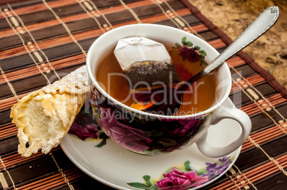 cup of tea with pastry after dinner