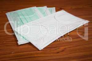 Medical sanitary mask on wood background