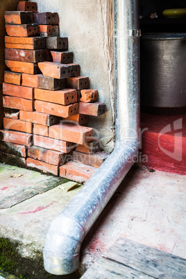 Old rain gutter with drainpipe inside  residence