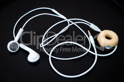 White earphones with line store isolated on dark background