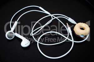 White earphones with line store isolated on dark background