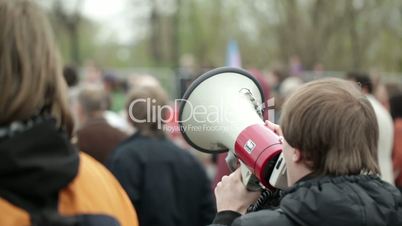 Young man shouting with a megaphone