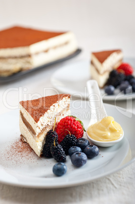 tiramisu dessert with berries and cream