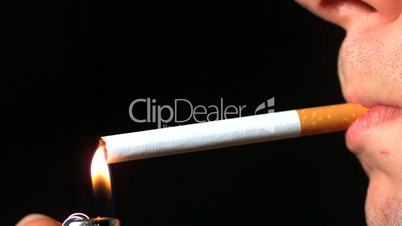 Man lighting cigarette side profile