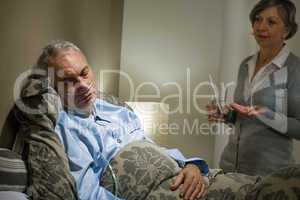 Ill old male patient and caring wife