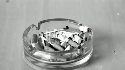 Cigarette falling in ashtray