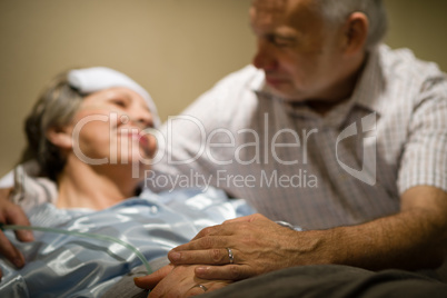 Old woman in pain lying bed