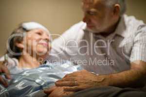 Old woman in pain lying bed