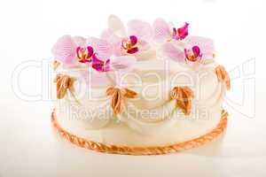 Tasty decorated cake in white marzipan coating