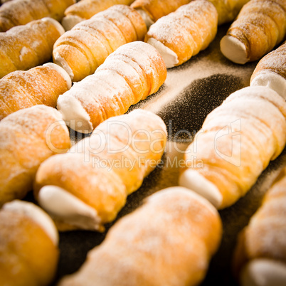 Cream horns decorated with powder sugar