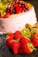 Fresh strawberries and kiwis with fruit cake