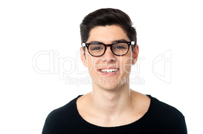 Smiling cool handsome young guy in eyeglasses