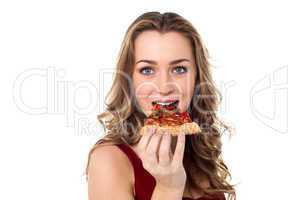 Young female having yummy pizza slice