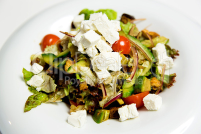 Summer salad with toppings of feta cheese