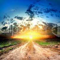 Country road and cumulus clouds