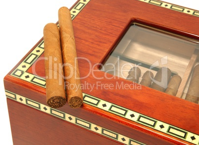 Two cigars on a humidor box