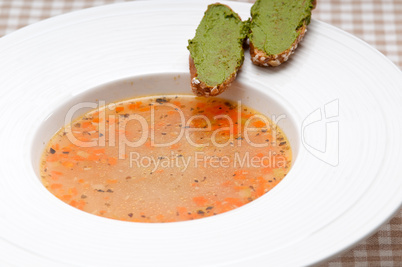 Italian minestrone soup with pesto crostini on side