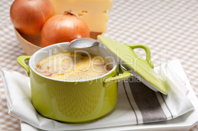 onion soup with melted cheese and bread on top