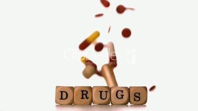 Different tablets pouring on dice spelling drugs