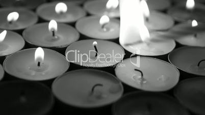 Hand lighting candles with birthday candle