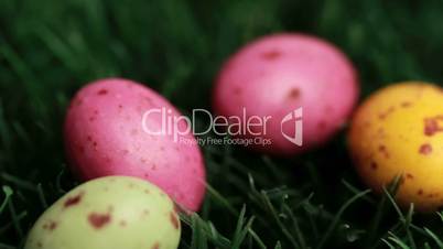 Easter eggs falling in the grass