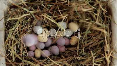 Sugar easter eggs falling in the straw