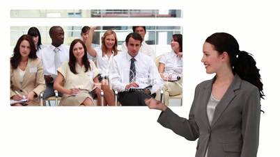 Business woman showing screen with business meeting