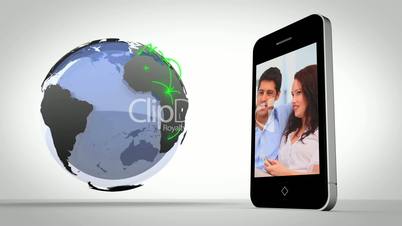 Video of couples presented on smartphone beside globe