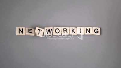 Plastic letters bouncing and spelling out networking