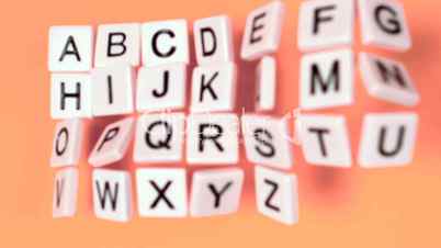 Plastic letters bouncing and showing alphabet on orange surface