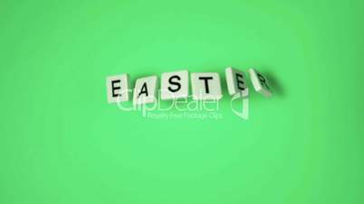 Plastic letters bouncing and spelling Easter on green surface