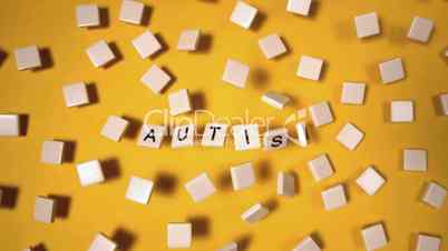 Plastic letters bouncing and spelling out autism