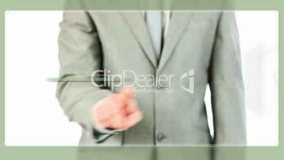 Businessman touching green graphic on screen