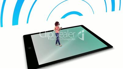 Girl walking on and using tablet pc with holographic application icons