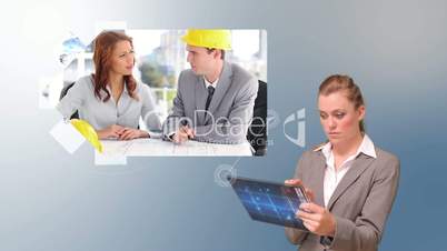 Businesswoman using tablet to view architect videos