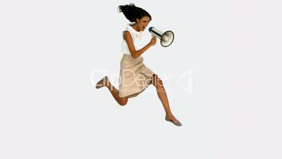 Angry businesswoman shouting on megaphone