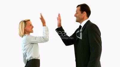 Business people high fiving each other