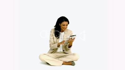 Woman cheering with her tablet on white background