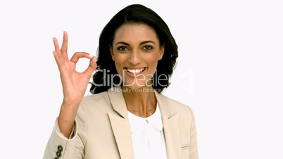 Businesswoman giving ok sign