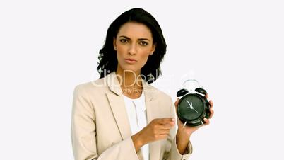 Businesswoman angrily pointing to the time