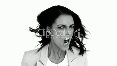 Businesswoman angrily shaking her head in black and white