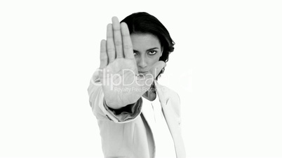 Businesswoman telling you to halt in black and white