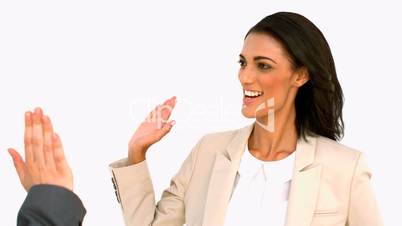 Businesswoman giving high five