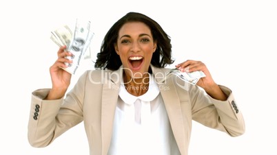 Cheerful businesswoman holding dollars and jumping