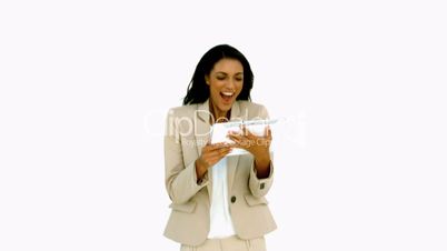 Businesswoman jumping and holding tablet