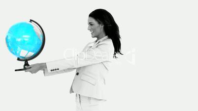 Businesswoman holding globe