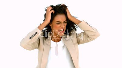 Stressed businesswoman tossing her hair